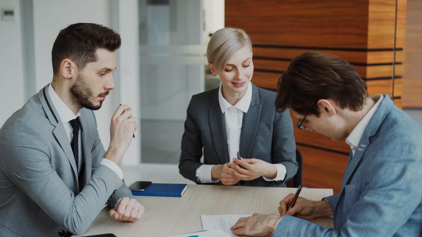 Business professionals reviewing a contract for AI vendor due diligence in the Philippines
