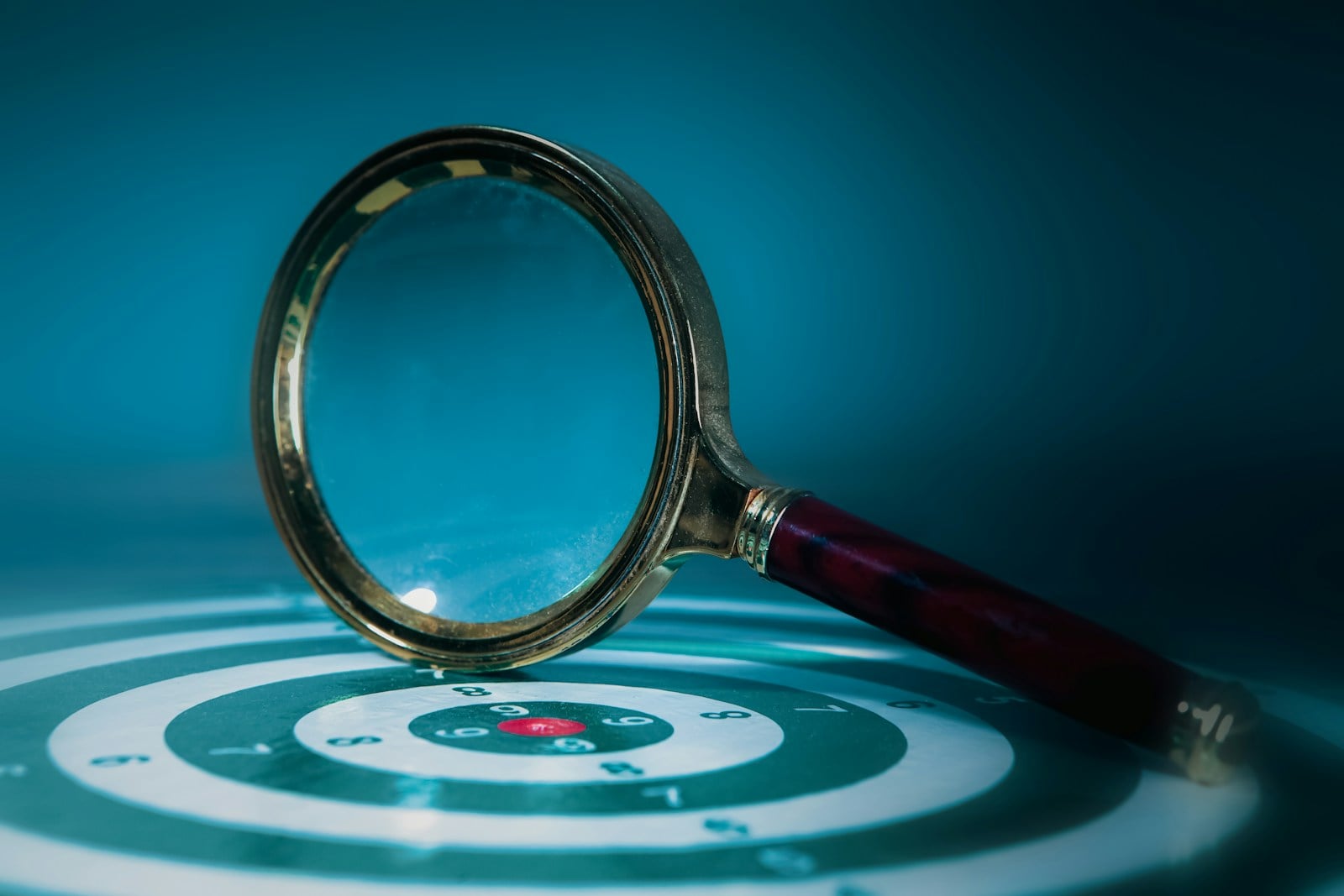 Magnifying glass and target representing automated decision-making and AI profiling in the Philippines