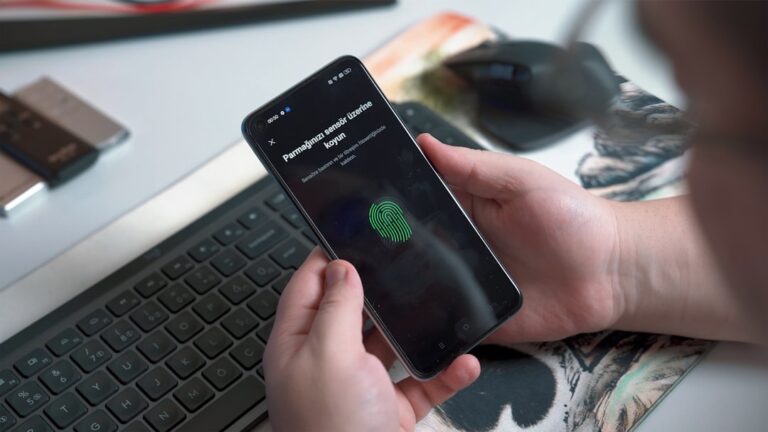 Fingerprint authentication on a smartphone representing identity theft and account security