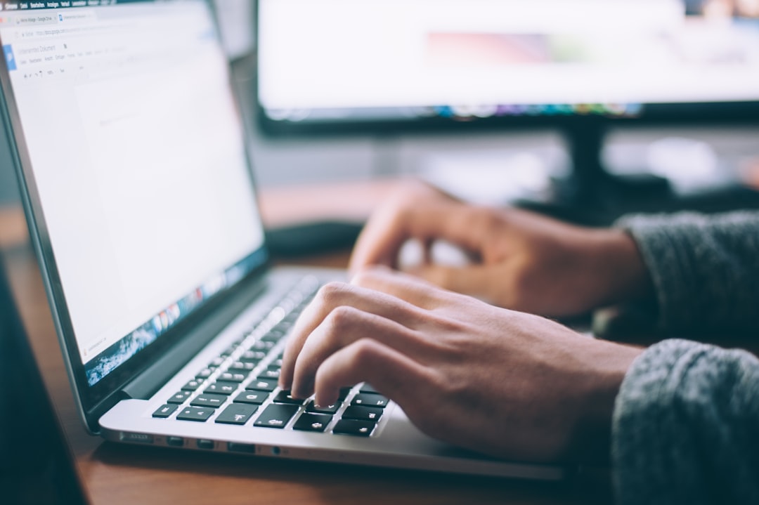 Employee using a laptop for phishing awareness and email security training