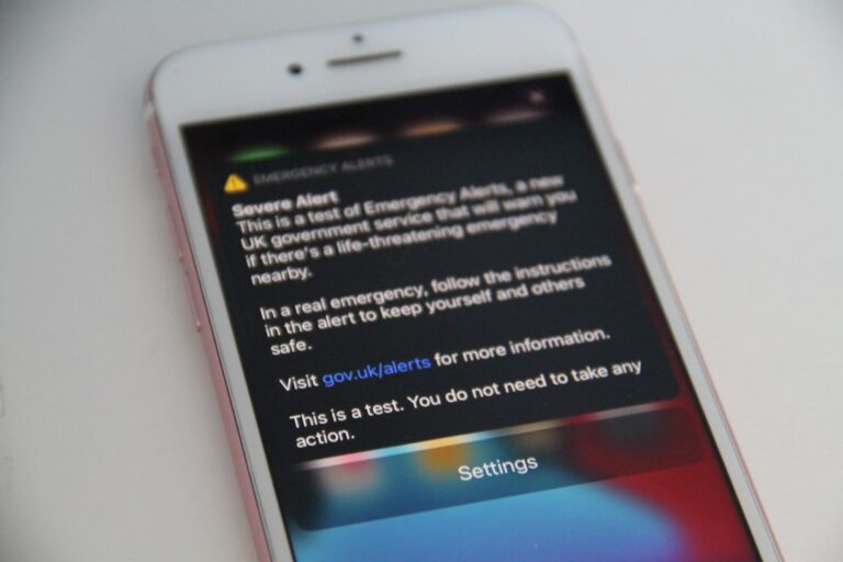 Smartphone used for online messages and scam awareness